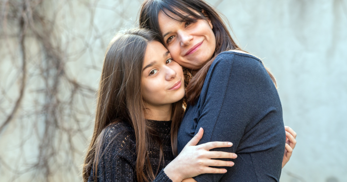 A mother and daughter hugging and being determined to stay committed to sobriety