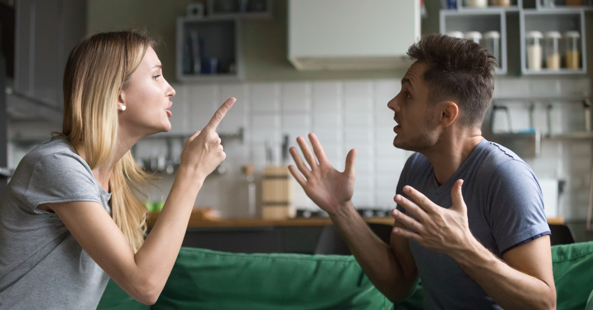 A couple engaged in a heated argument on a couch while blaming each other for their addiction.