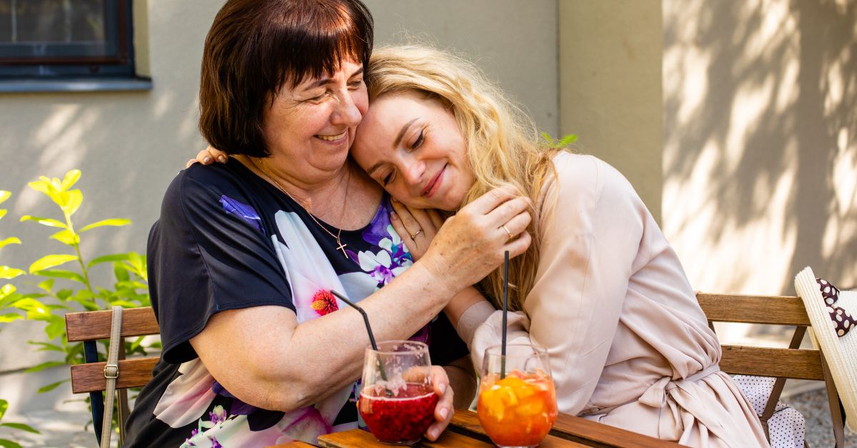 Mother and her daughter hugingMother and daughter, hugging and using self-care to achieve long-term sobriety, share a moment of deep connection and strength.