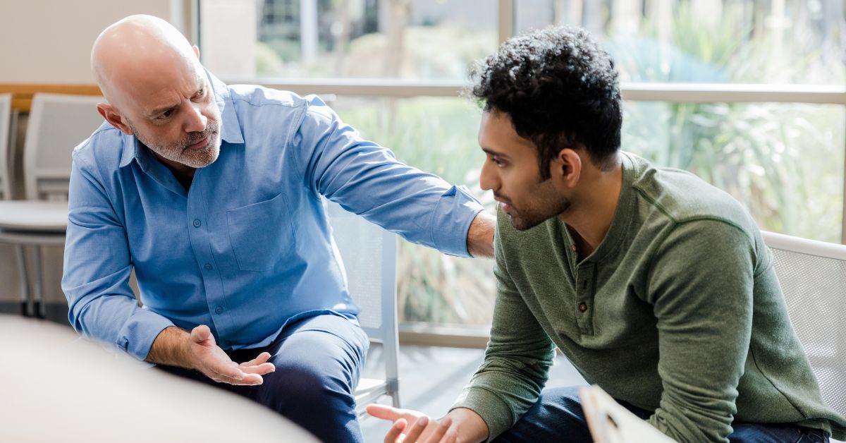 A man sitting with his therapist engaging in a conversation on tips to overcome sobriety fatigue.