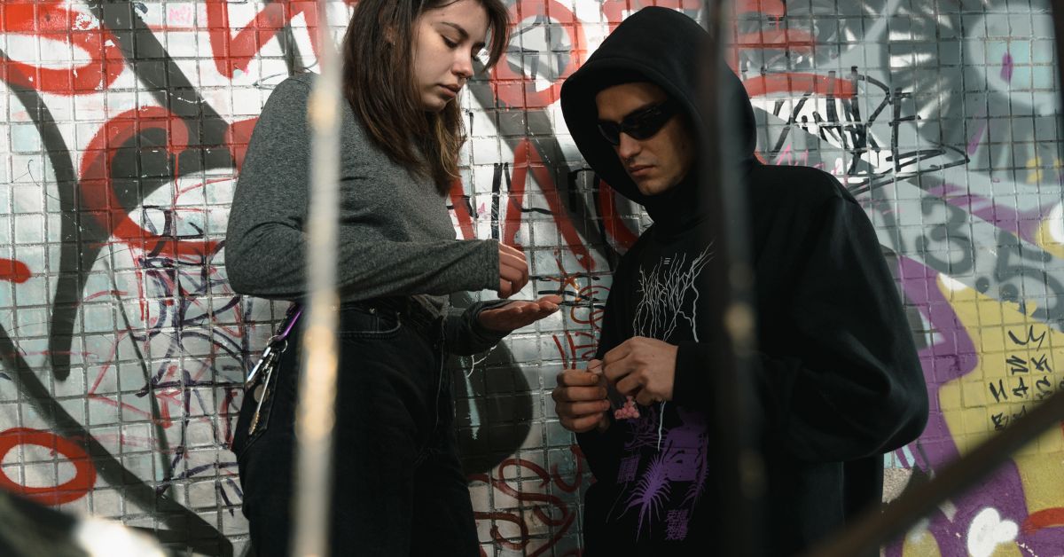 A woman buying drugs