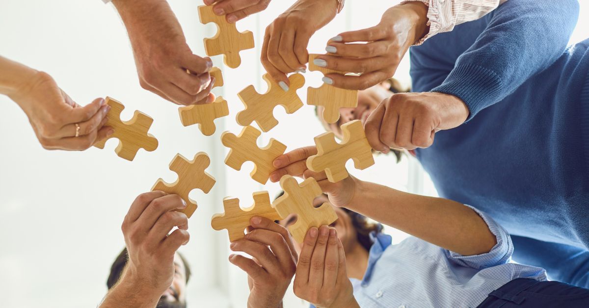 A family putting puzzle pieces together symbolizes ongoing support for substance abuse treatment.