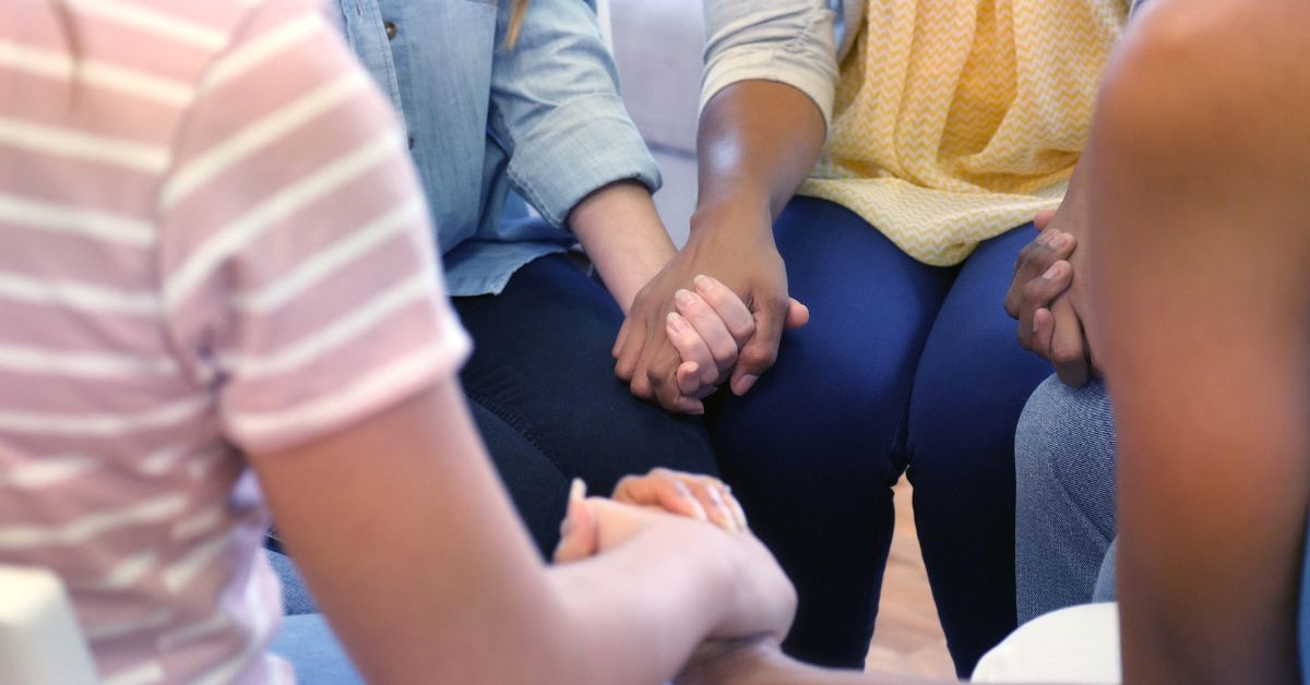 A circle of individuals demonstrating family support in preventing relapse