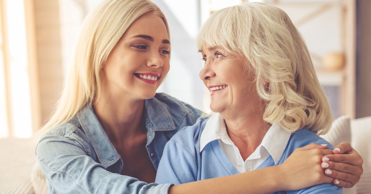 A woman is hugging an older woman, symbolizing rebuilding relationships in recovery.